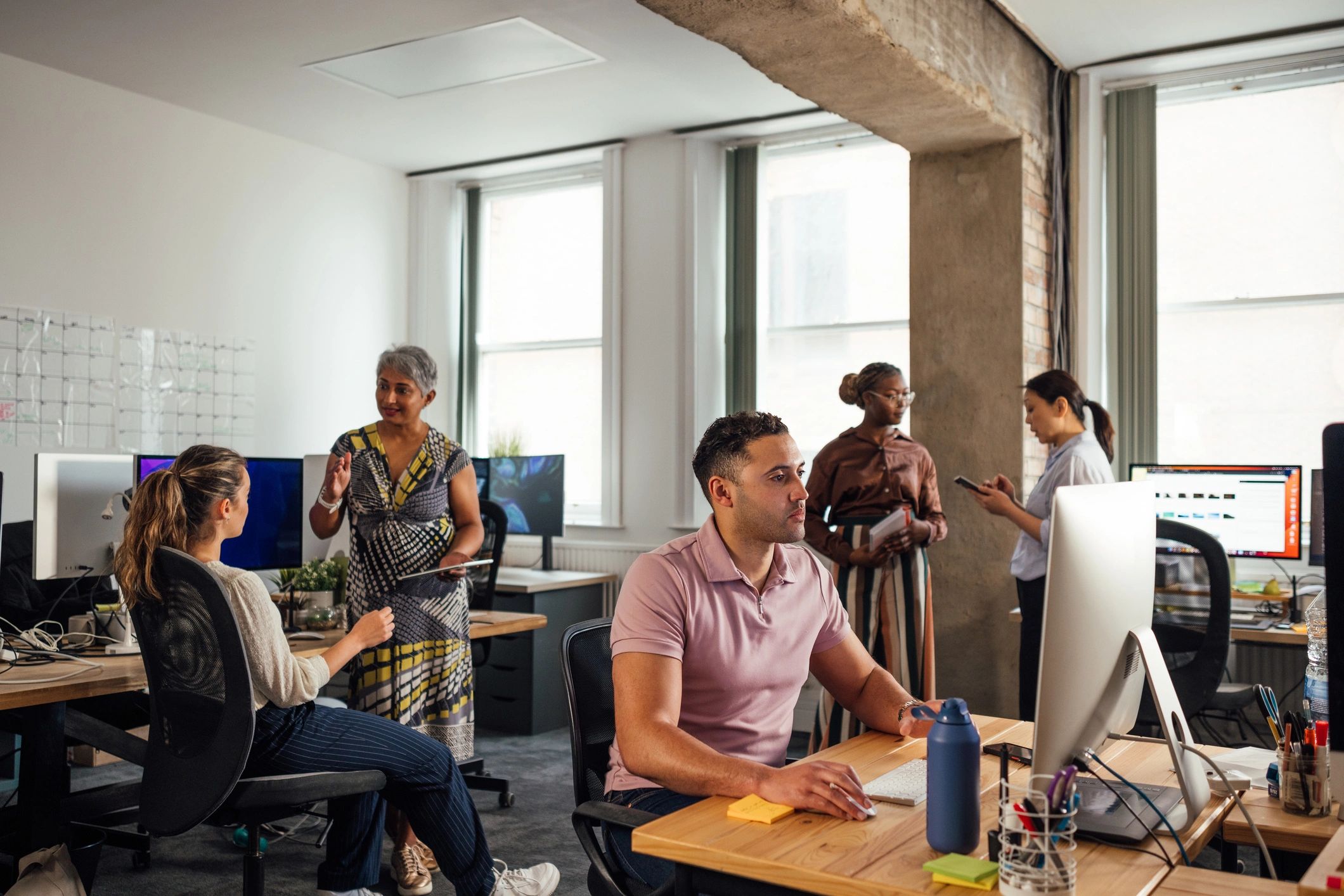 Technology professionals working together in an office